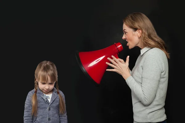 Woman Shouting Loudspeaker Sad Child Girl Black Background Abuse Concept — Stock Photo, Image