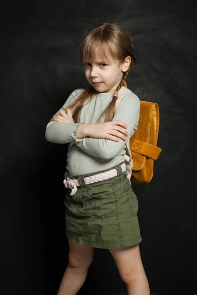 Child Girl Crossed Arms Blackboard Background — Stock Photo, Image