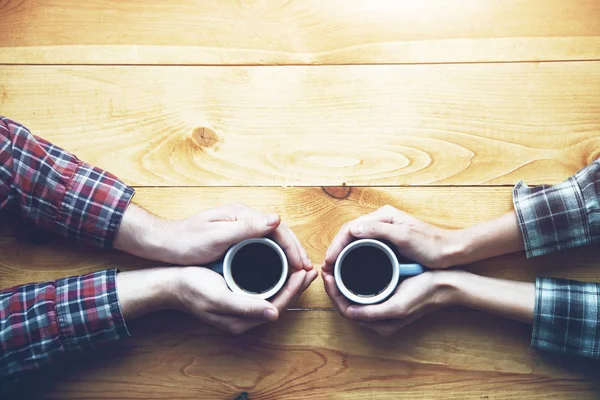 Hands Couple Two Cups Coffee Wooden Table Elevated View — Stock Photo, Image