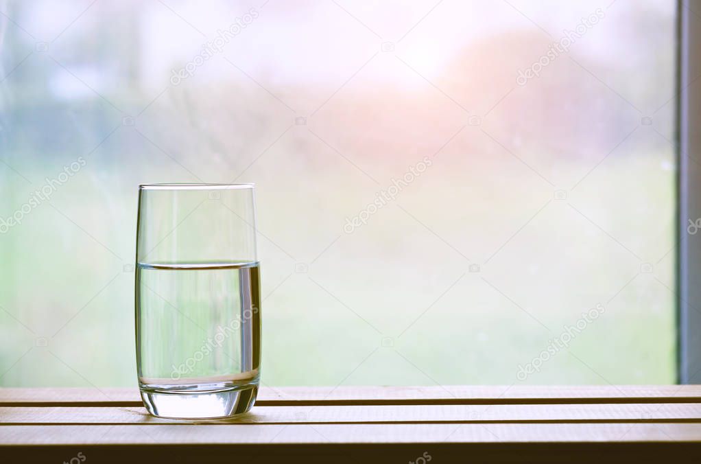 New day with glass of water. Space for text