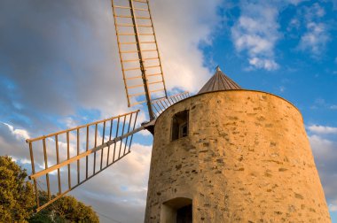 Porquerolles island landmark - old windmill at the hill above the town. clipart