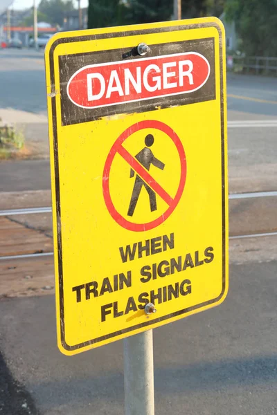 English Sign Warns Pedestrians Area Dangerous Train Signals Flashing — Stock Photo, Image