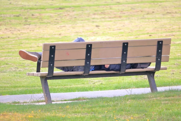 Close View Homeless Man Stretched Out Sleeping Park Bench — Stock Photo, Image
