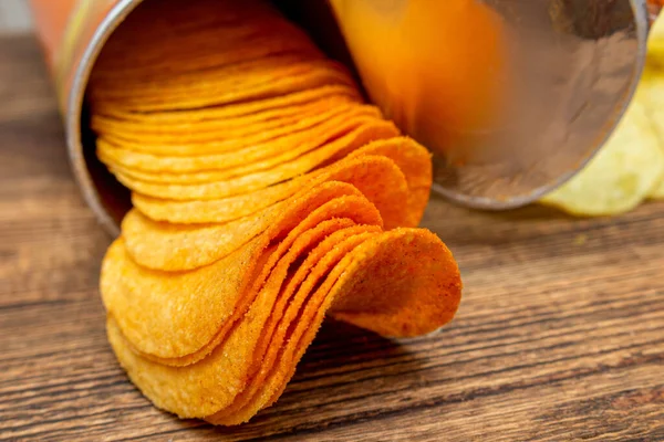 lot of orange potato chips in tube pack close up