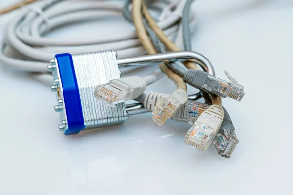 bundle of network wires blocked with metal padlock on white background