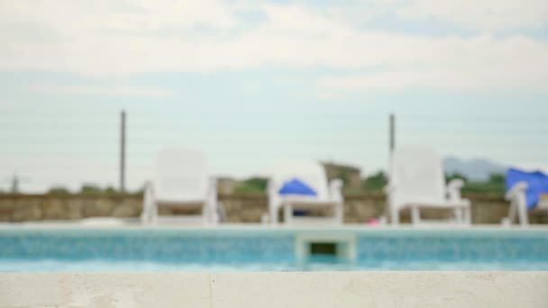 Blond Girl Emerges Poolside Smiling Camera — Stock Video