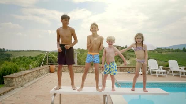 Slow Motion Video Four Happy Kids Dancing Plank Poolside — Stock Video