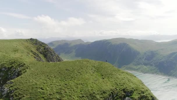 Aerial Shot Man Travelling Relaxing Top Mountain Admiring Beach Valley — Stock Video