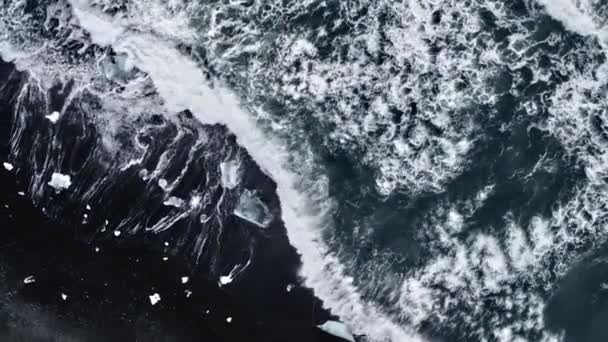 Waves polishing the ice diamonds — Stock Video
