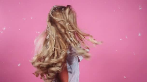 Teenage Girl Tossing Hair Free Of Feathers — Stock Video