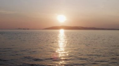 Areal View of the Sun Setting Over a Calm Sea, Komodo Indonesia