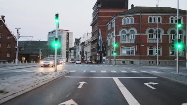 POV shot of a person driving a car along the Busy Streets in Aarhus Denmark — Stock video