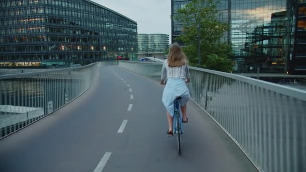 Woman Riding Bicycle Along Bridge In City — Stock Video