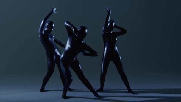 Three Dancers Slow Dancing on Latex Overalls — Stock Video