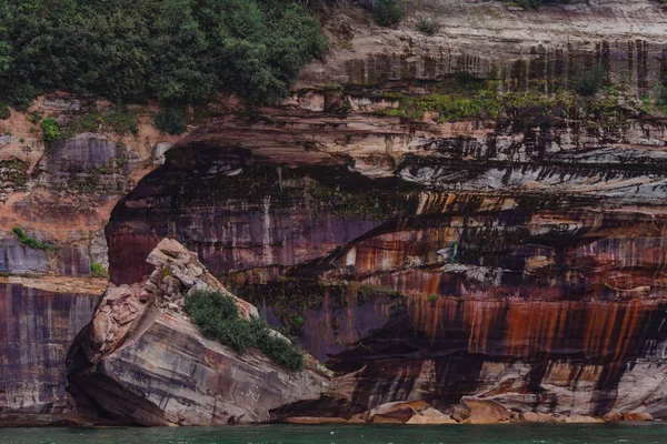 Pictured rocks national park on the Lake Superior, USA. Colorful textured rocks background