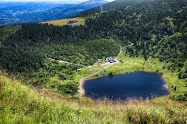 The glacier lake on the polish side of Krkonose- National park of Czech republic. This the road of czech and polish friendship to the Snezka. the highest mountain of Czech republic. clipart