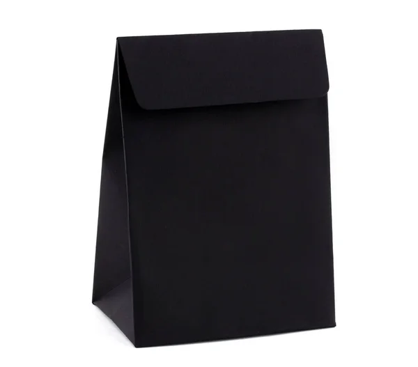 하얀 배경에는 검은 색 선물용 쇼핑 백 이 따로 있다. 귀하의 로고를 위한 공간 이 종이 럭셔리 백에 있습니다. 할인, 판매, 블랙 프라이데이. — 스톡 사진