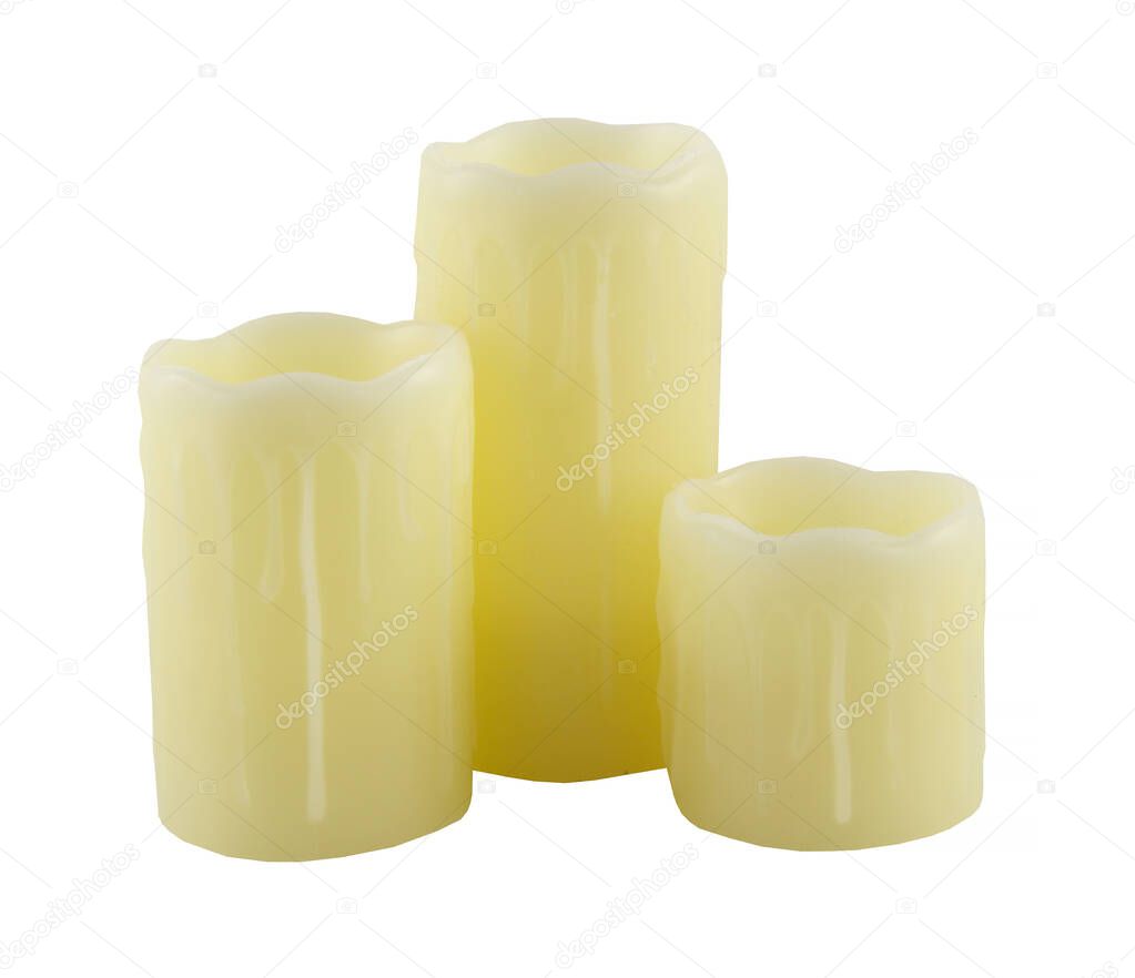 Christmas candles in gold color. They are decorative candles and have waxed on them.