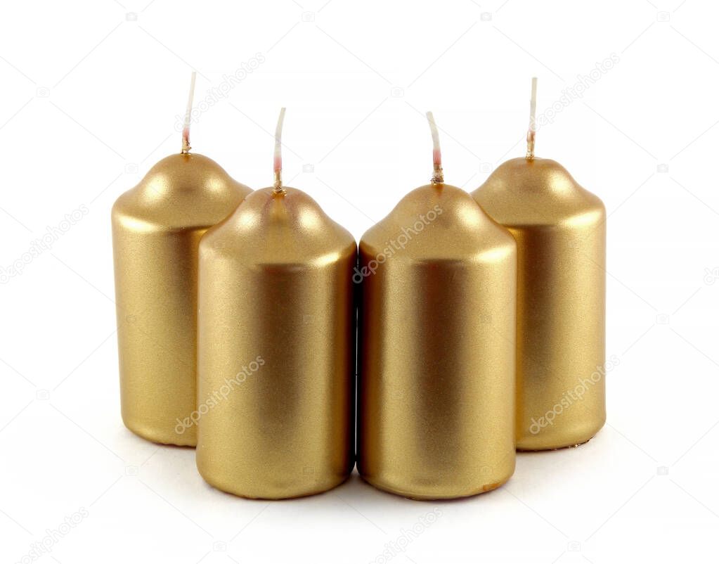 Christmas candles in gold color. They are decorative candles.