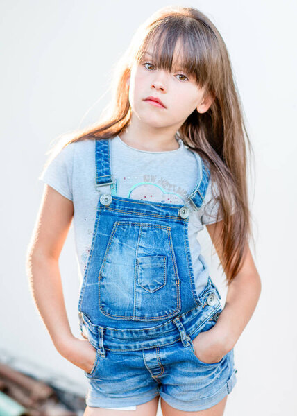 portrait of little girl outdoors in summer