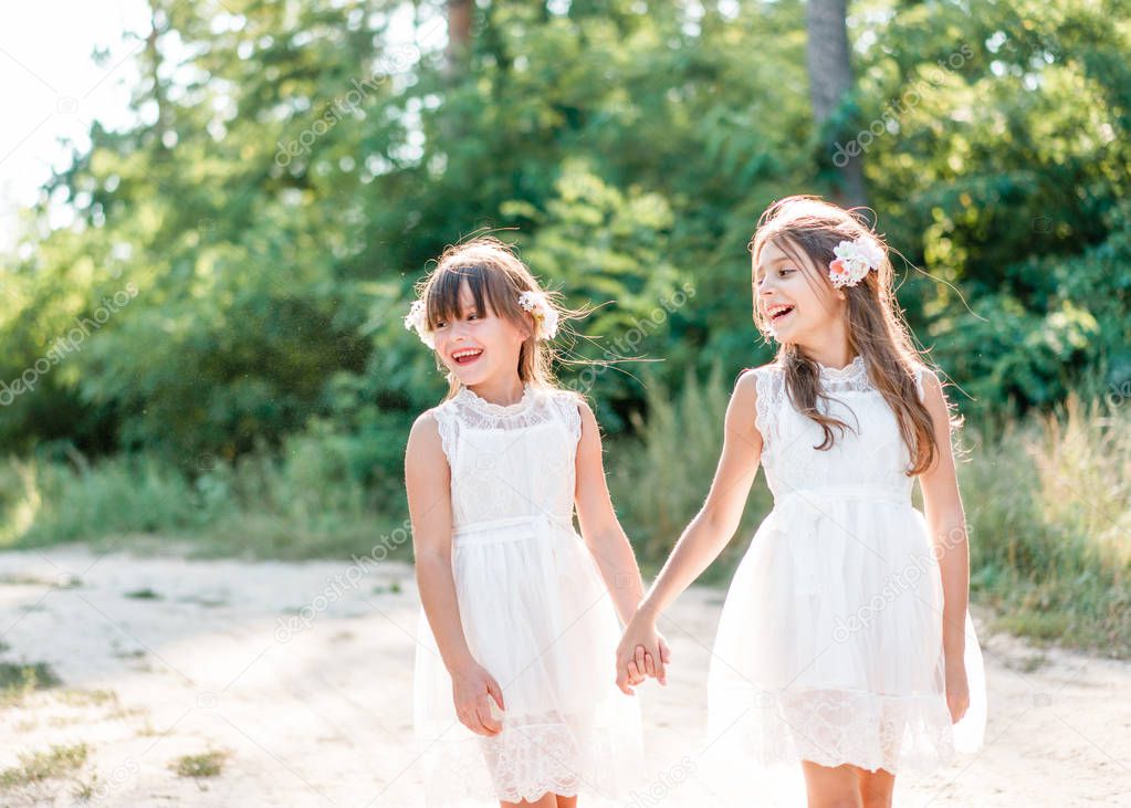 Portrait of two girls in the woods girlfriends