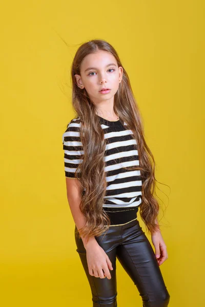 portrait of little model girl in studio