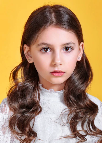 portrait of little model girl in studio