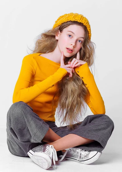 portrait of little model girl in studio