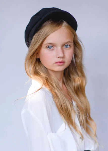 portrait of little model girl in studio