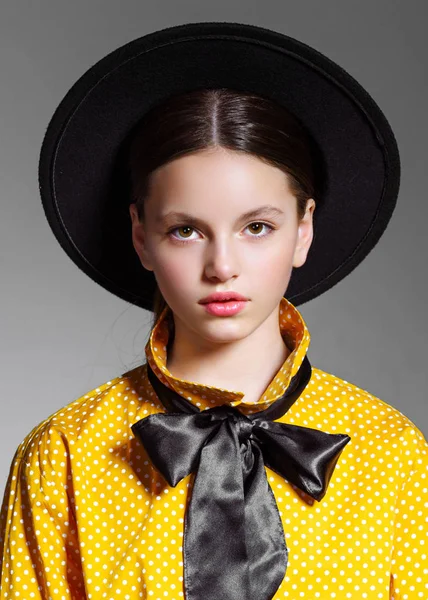 portrait of little model girl in studio