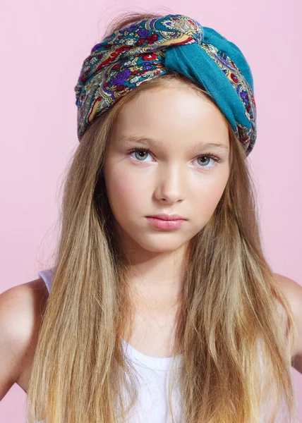 portrait of little model girl in studio