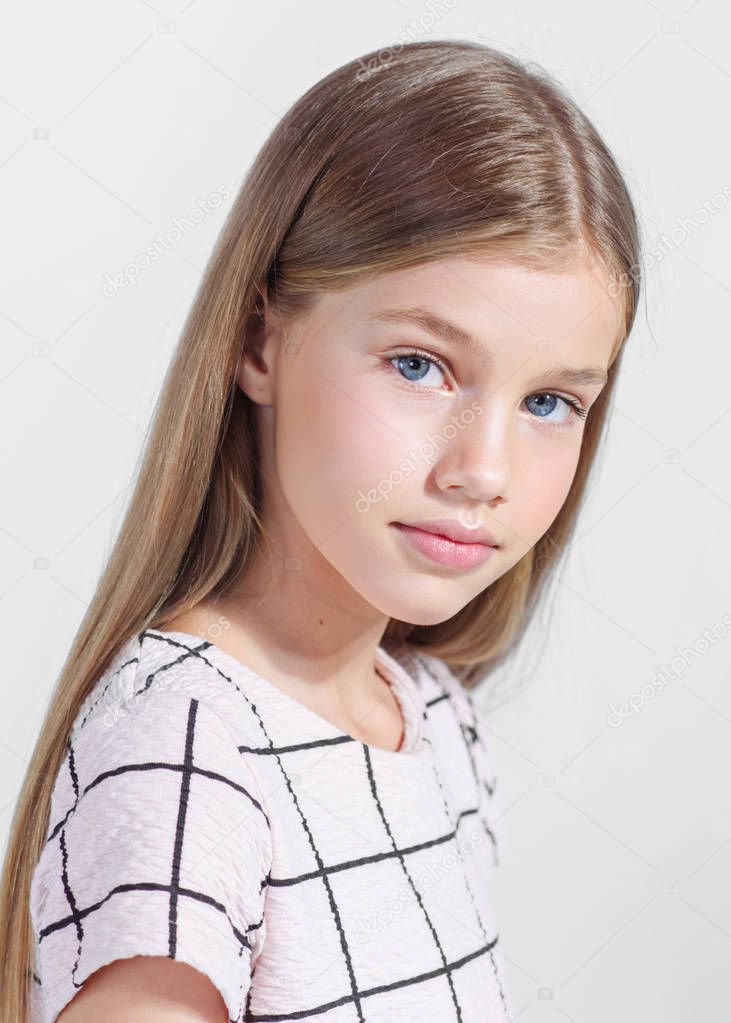 portrait of little model girl in studio