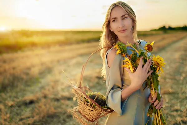 Positive young blonde woman in light summer dress — Stock Photo, Image