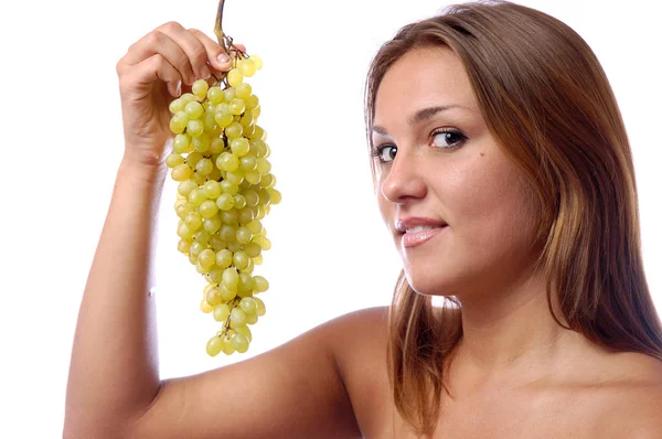 Hungry girl wants to eat delicious juicy grapes — Stock Photo, Image
