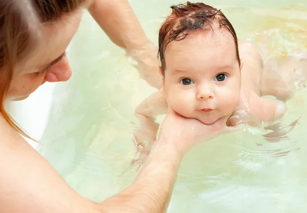 Little charming girl bathes in warm water — Stock Photo, Image