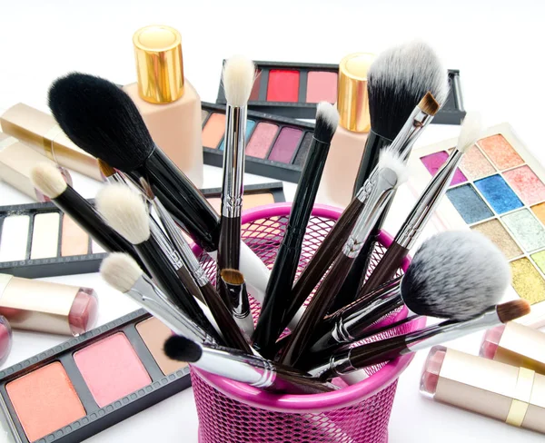 Various set of professional makeup brushes and cosmetics and pal Royalty Free Stock Images