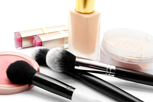 Various set of professional makeup brushes and cosmetics isolate