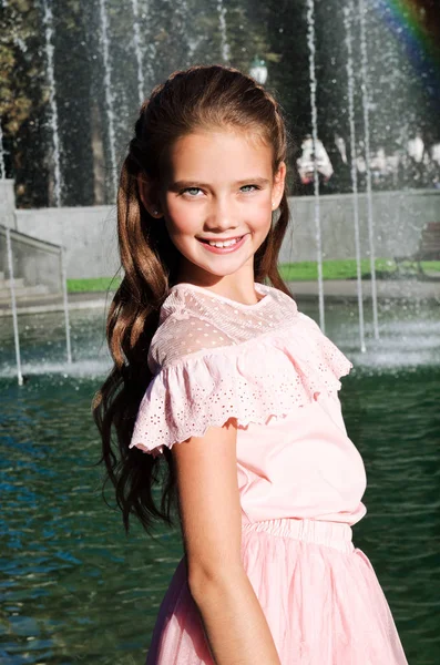 Portrait of adorable smiling happy little girl child in the park — Stock Photo, Image