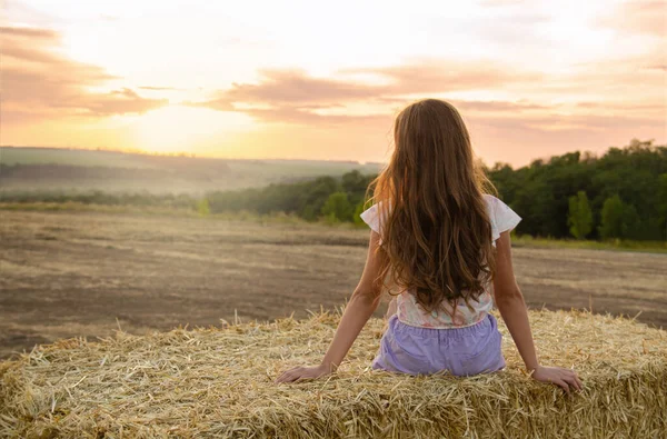 Adorable Little Girl Child Sitting Hay Rolls Wheat Field Sunset — Stock Photo, Image