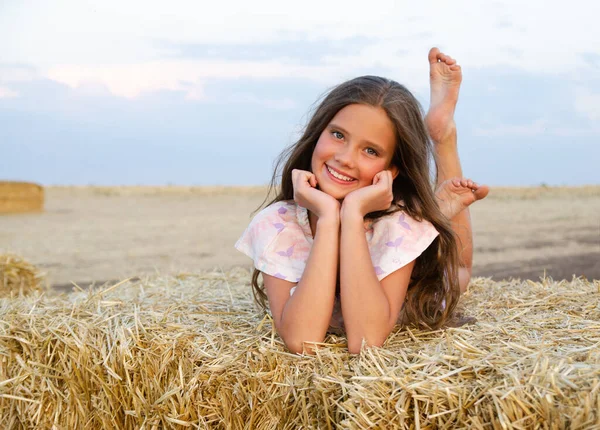 Adorable Happy Smiling Ittle Girl Child Lying Hay Rolls Wheat — Stock Photo, Image