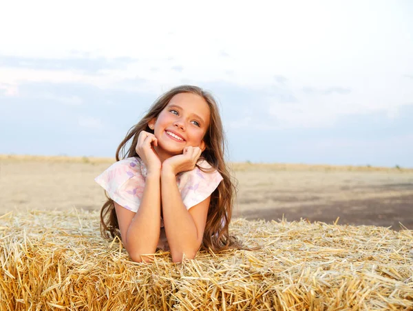 Adorable Happy Smiling Ittle Girl Child Lying Hay Rolls Wheat — Stock Photo, Image