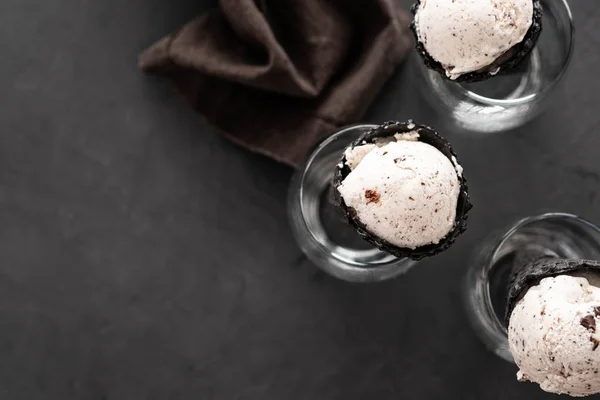 Speciality Italian stracciatella ice cream scoop with flakes of dark chocolate in a creamy vanilla ice-cream. Top view.