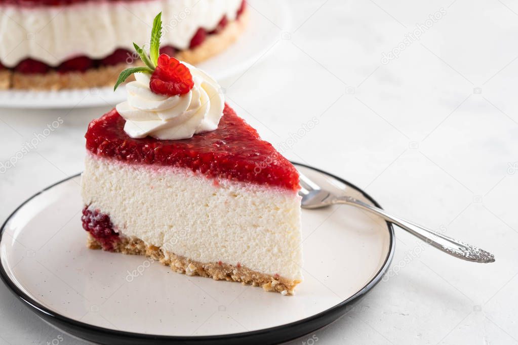 Raspberry tart, mousse cake, cheesecake with fresh raspberries. Piece of cheesecake on a white plate.