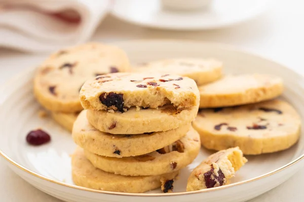 Christmas round cookies with walnuts and dried cranberries. Selective focus. Copy space.