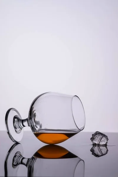 Glass of cognac on on white background. Copy space. — Stock Photo, Image