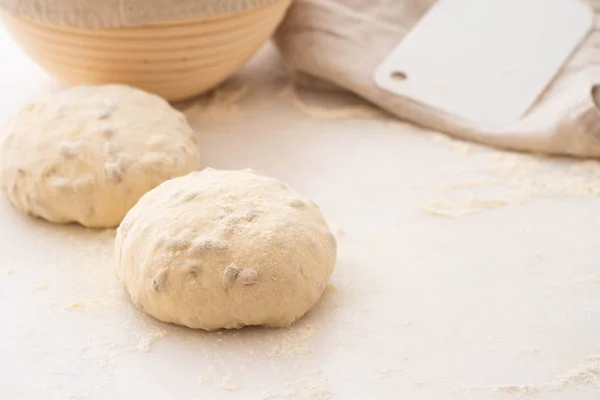 Balls of dough covered with wheat flour ready for baking. Copy space. — Stock Photo, Image