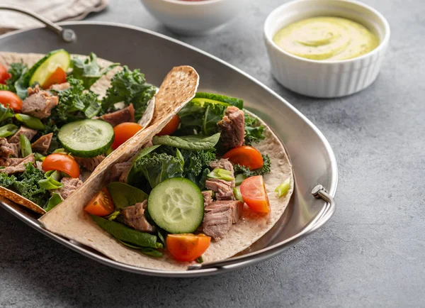 Two mexican pork carnitas tacos with sauces and vegetables. — Stock Photo, Image