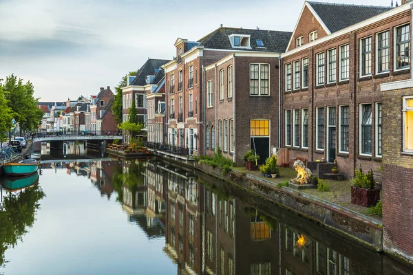 Traditional Dutch culture houses and canal during dusk in Leiden