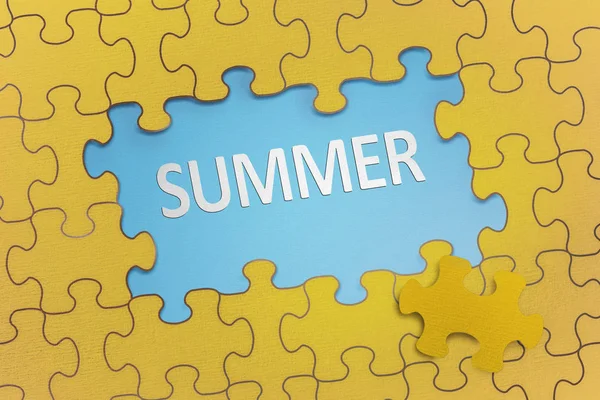 Summer text on yellow puzzle with blue background