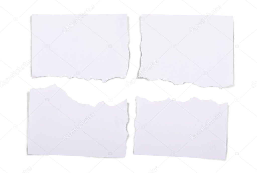 Ripped pieces of white paper isolated over white background